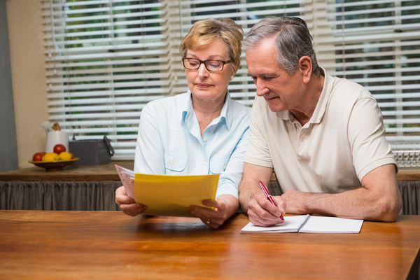 older couple doing paperwork