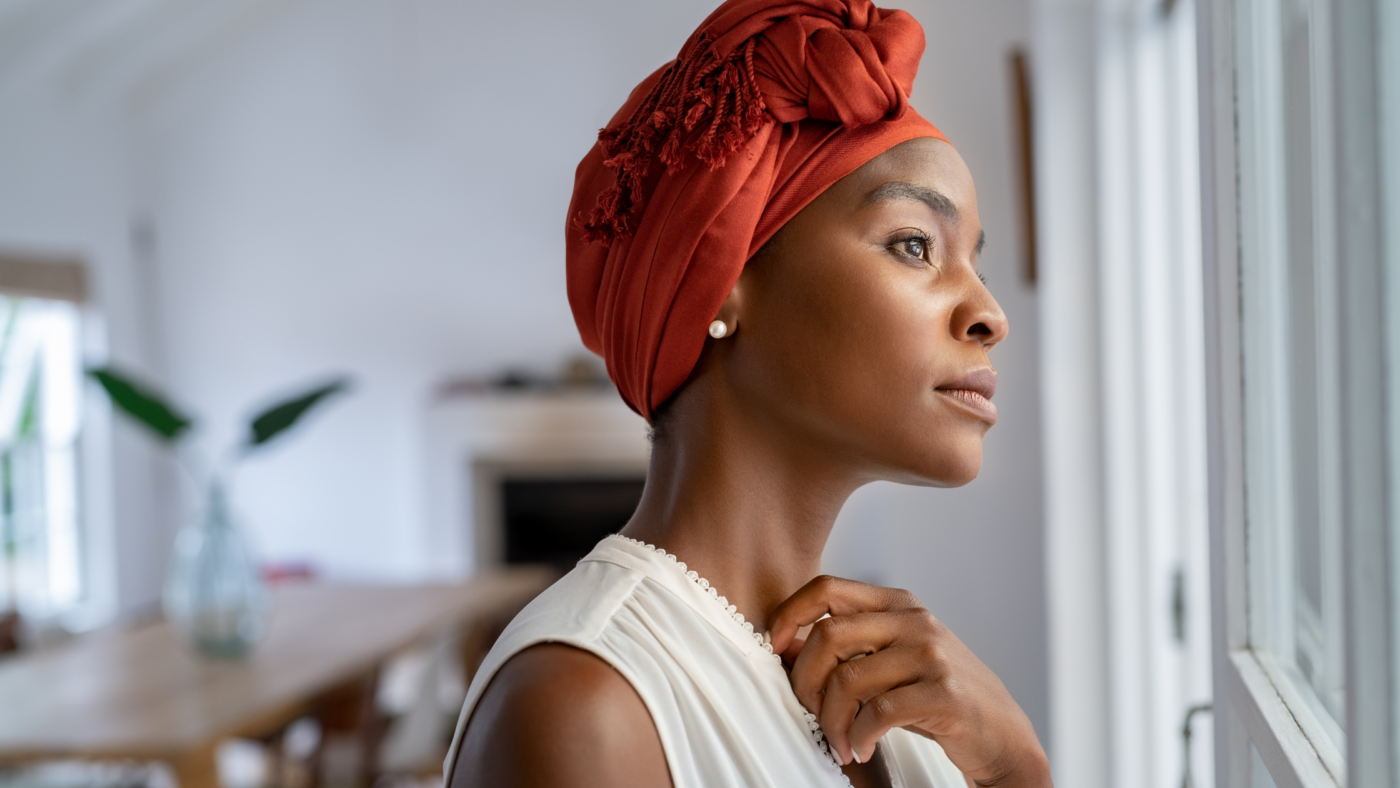 Black Woman looking out window